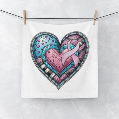 Heart-shaped towel design featuring blue and pink hearts with a pink ribbon, hanging on a line.